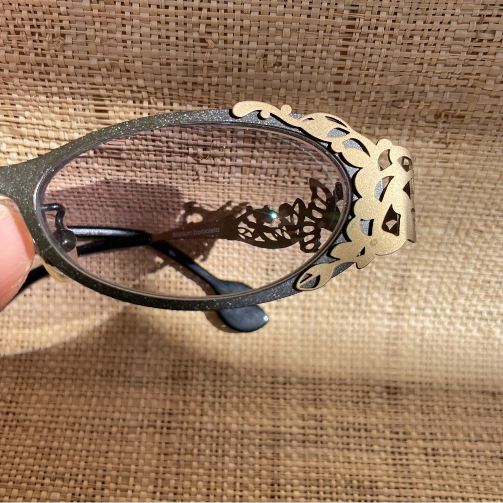 Kamuro Borboleta titanium glasses frames with intricate butterfly detailing